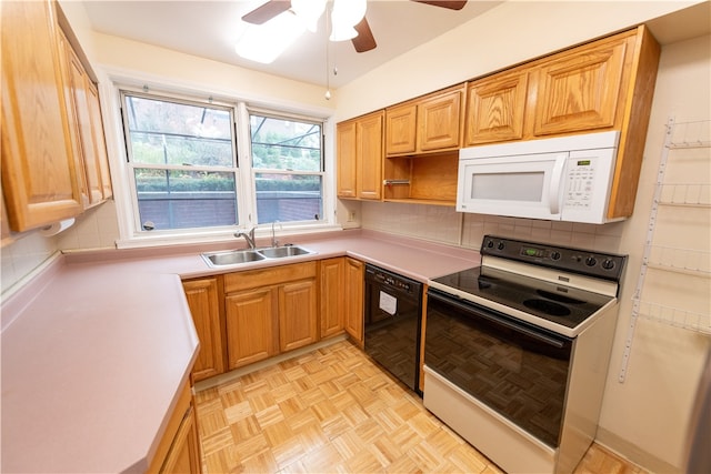 kitchen featuring backsplash, electric stove, sink, ceiling fan, and black dishwasher