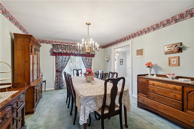 dining room with carpet floors and a notable chandelier