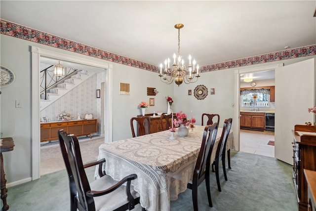 dining space with light colored carpet, sink, and an inviting chandelier