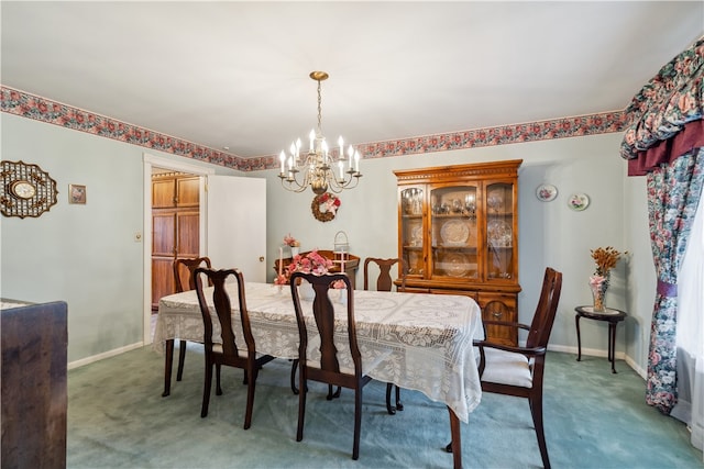 dining space featuring dark carpet and a notable chandelier