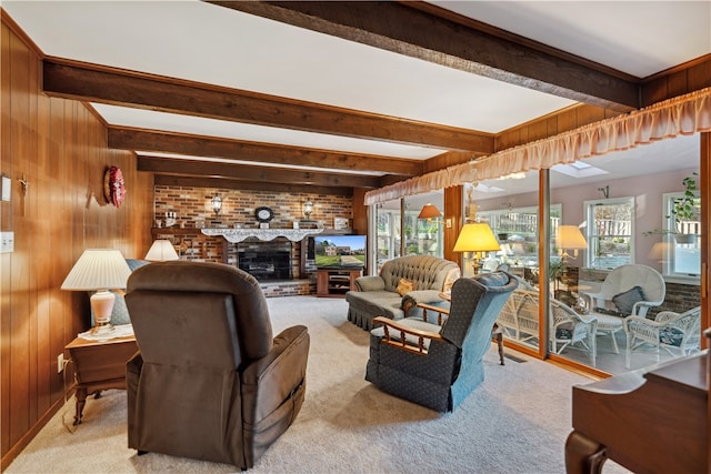 living room with beam ceiling, wooden walls, and a healthy amount of sunlight