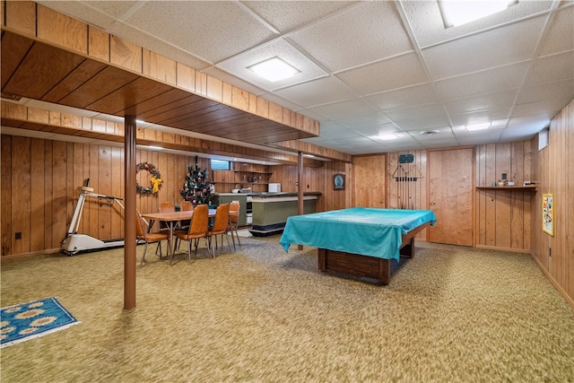 rec room featuring wood walls, a drop ceiling, carpet, and billiards