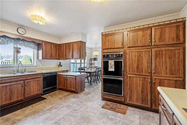 kitchen featuring tasteful backsplash, ornamental molding, sink, black appliances, and hanging light fixtures