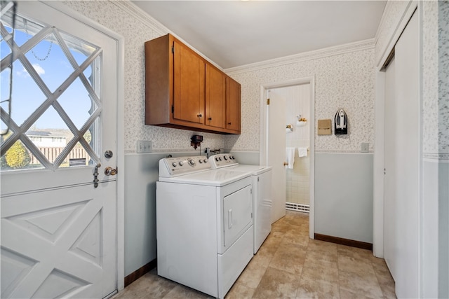 washroom with cabinets, light tile patterned floors, washer and clothes dryer, and ornamental molding