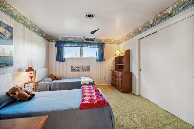 carpeted bedroom with a closet