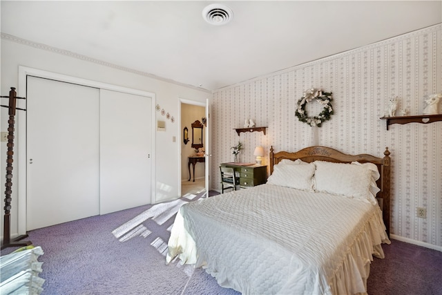 carpeted bedroom with a closet