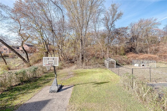 view of yard with basketball hoop