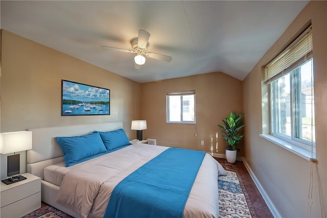 bedroom featuring ceiling fan and vaulted ceiling