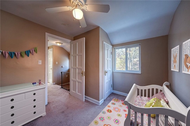 bedroom with light carpet, vaulted ceiling, and ceiling fan