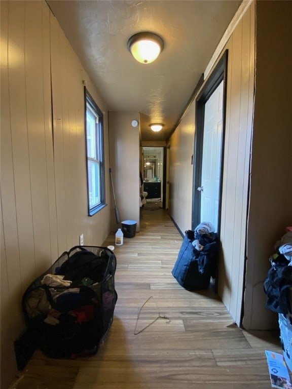 corridor with light wood-type flooring