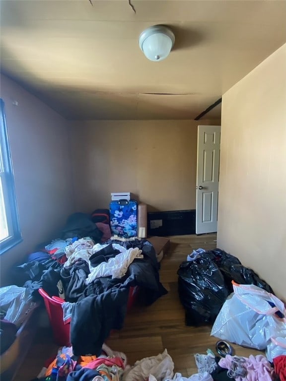 bedroom with hardwood / wood-style floors