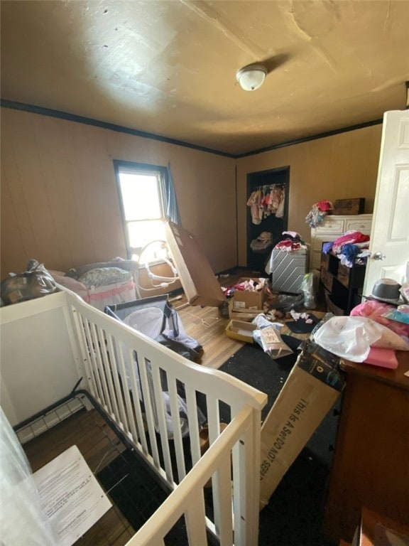 miscellaneous room featuring wood walls