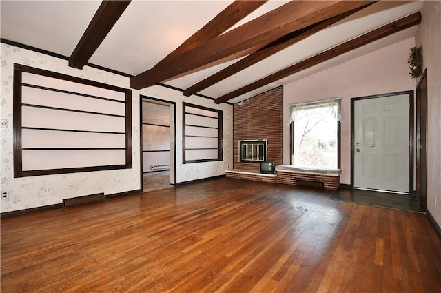 unfurnished living room featuring a fireplace, lofted ceiling with beams, and dark hardwood / wood-style floors