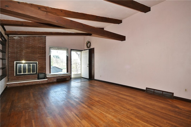 unfurnished living room with dark hardwood / wood-style flooring, vaulted ceiling with beams, and a brick fireplace