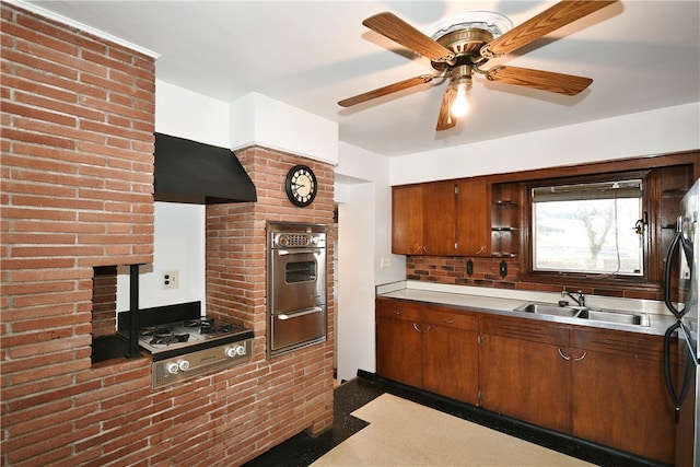 kitchen with premium range hood, ceiling fan, sink, and stainless steel appliances