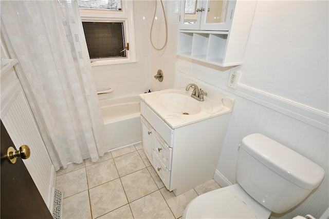 full bathroom featuring toilet, shower / tub combo, vanity, and tile patterned floors