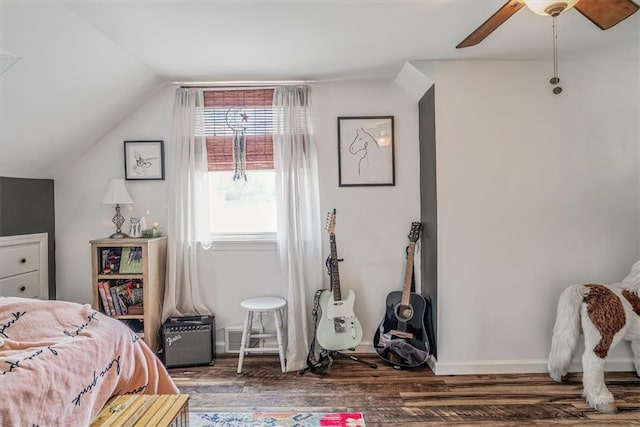 bedroom featuring dark hardwood / wood-style floors, ceiling fan, and lofted ceiling