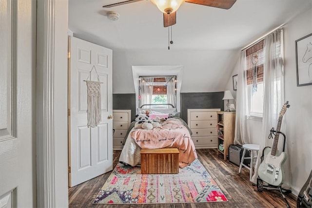 bedroom featuring ceiling fan, lofted ceiling, and dark wood-type flooring