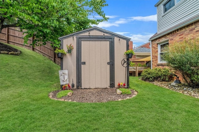 view of outbuilding featuring a lawn