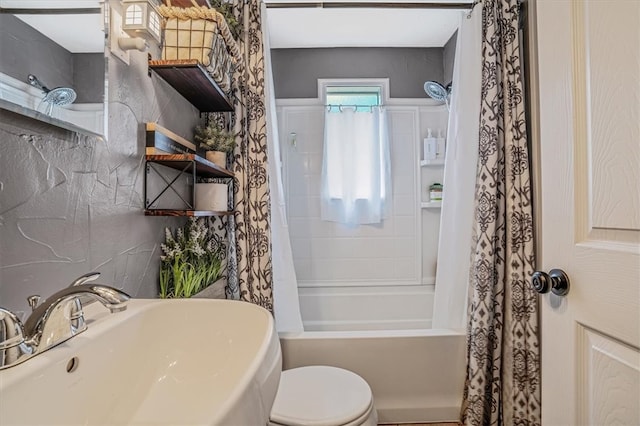 full bathroom with sink, shower / bath combination with curtain, and toilet