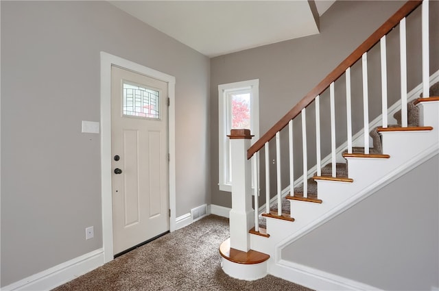 view of carpeted foyer