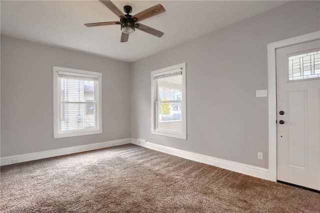 interior space featuring carpet flooring and ceiling fan