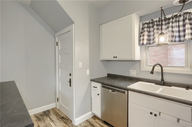 kitchen with dishwasher, white cabinets, light hardwood / wood-style floors, and sink