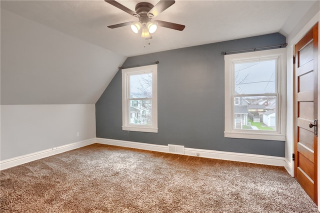 bonus room featuring carpet flooring and plenty of natural light