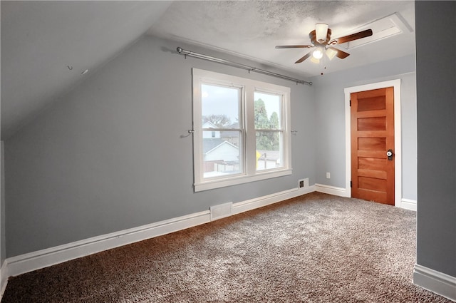 bonus room with a textured ceiling, ceiling fan, lofted ceiling, and carpet floors