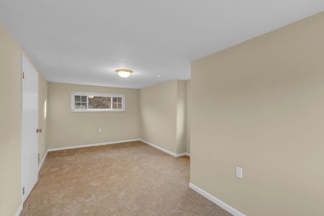 unfurnished room with light colored carpet