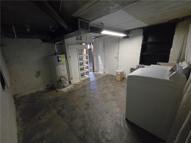 basement with gas water heater and independent washer and dryer