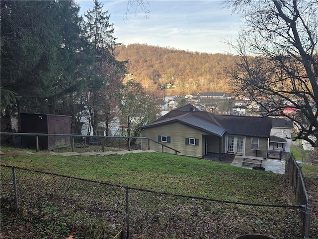 rear view of house with a yard