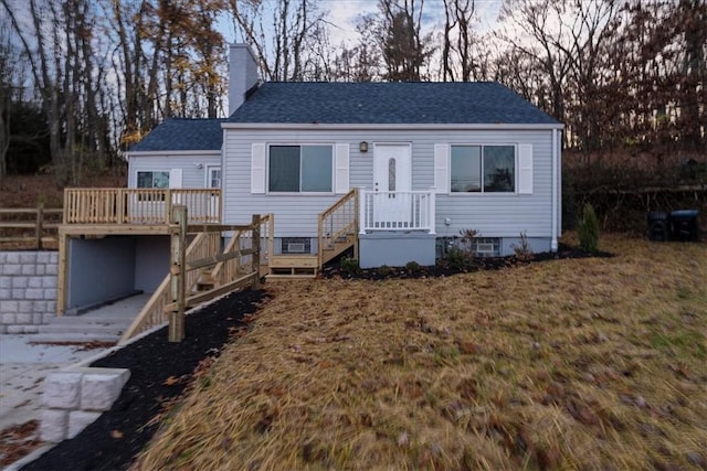 190 Pine Creek Rd, Mccandless, PA 15090 - view of front of house with a chimney, a shingled roof, a wooden deck, and a front lawn