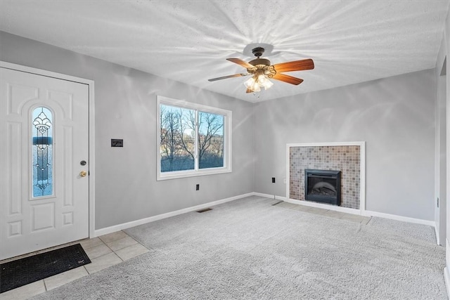 190 Pine Creek Rd, Mccandless, PA 15090 - tiled foyer featuring a ceiling fan, carpet, a tile fireplace, and baseboards