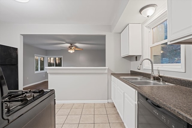 kitchen with sink, white cabinets, and black appliances