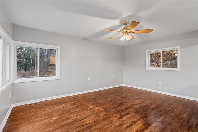 spare room featuring ceiling fan and hardwood / wood-style flooring