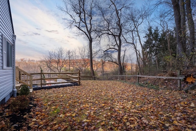 view of yard at dusk