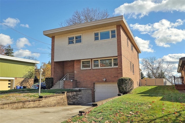 exterior space with a front yard and a garage