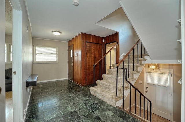 entryway with crown molding