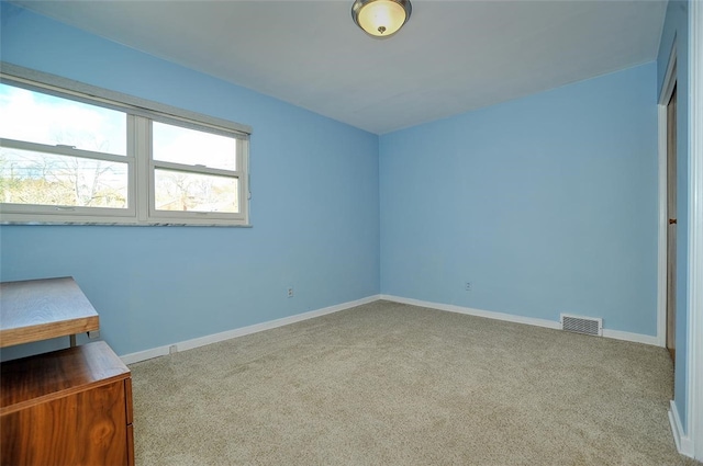 unfurnished bedroom featuring light colored carpet