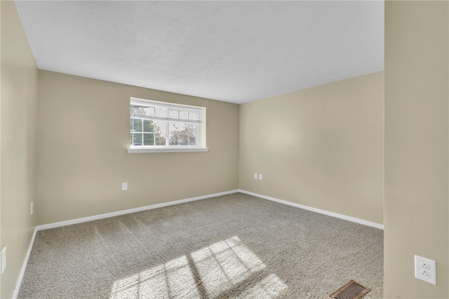 unfurnished room featuring carpet