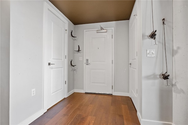 entryway with hardwood / wood-style flooring