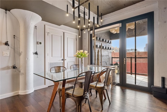 dining area featuring dark hardwood / wood-style flooring