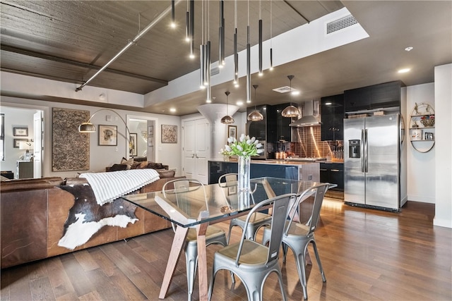 dining space featuring dark hardwood / wood-style flooring