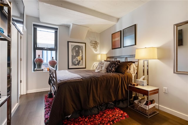 bedroom with dark wood-type flooring