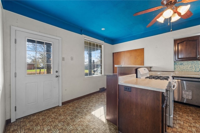 kitchen with dishwasher, a healthy amount of sunlight, white gas range, and ceiling fan