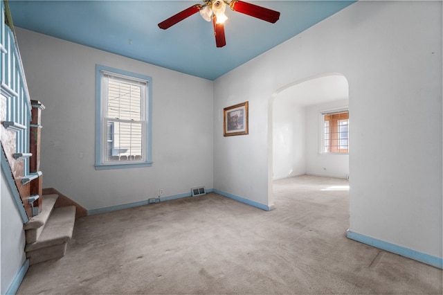 carpeted empty room with ceiling fan