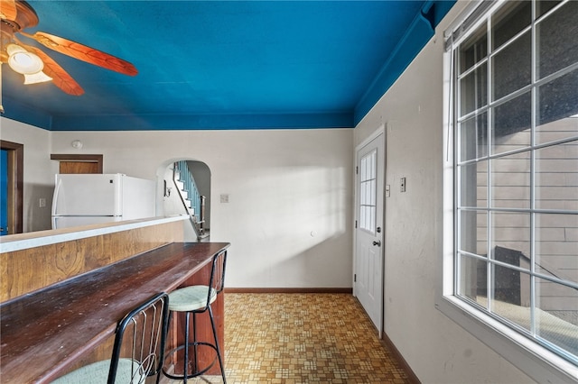 kitchen with white fridge and ceiling fan