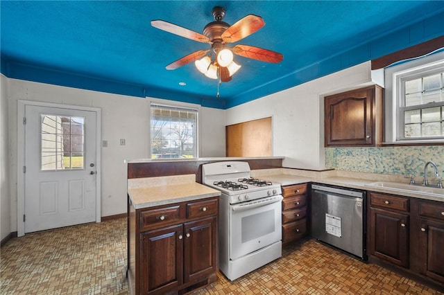 kitchen with dishwasher, white gas range oven, dark brown cabinetry, and sink