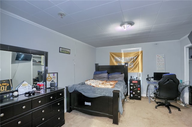 carpeted bedroom featuring ornamental molding